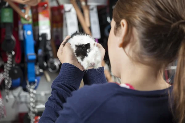 Rear View Of Girl Holding Guinea Pig — Stock Photo, Image