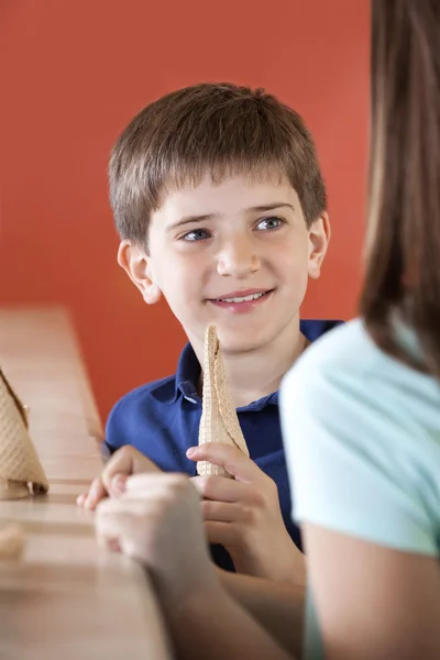 Boy Holding Cone While Looking At Sister — Stock Photo, Image