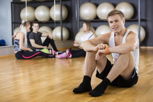 Portrait Of Man Looking At Activity Tracker At Gym — Stock Photo, Image