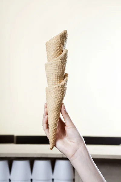 Waitresss Holding Stacked Ice Cream Cones — стоковое фото