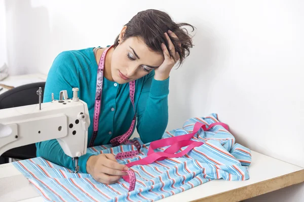 Exhausted Tailor Leaning On Workbench — Stock Photo, Image