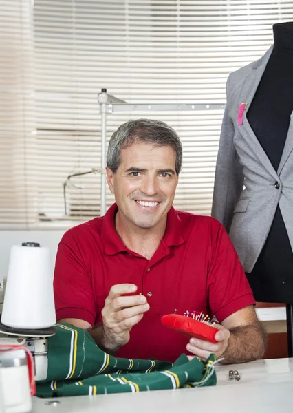 Happy Fashion Designer Sitting At Workbench — Stock Photo, Image