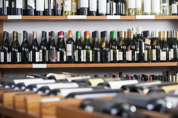 Wine Bottles Displayed On Shelves — Stock Photo, Image