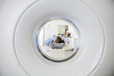 Woman Undergoing CT Scan clipart