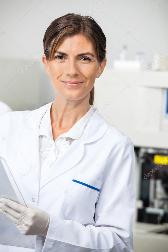 Confident Female Scientist In Lab