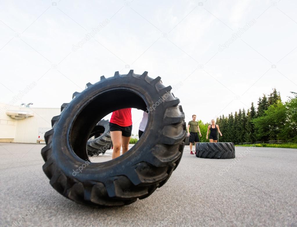 Athlete Lifting Large Tractor Tire