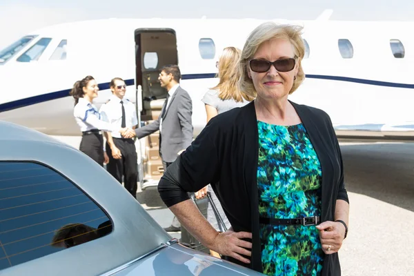 Confident Businesswoman Against Private Jet — Stock Photo, Image