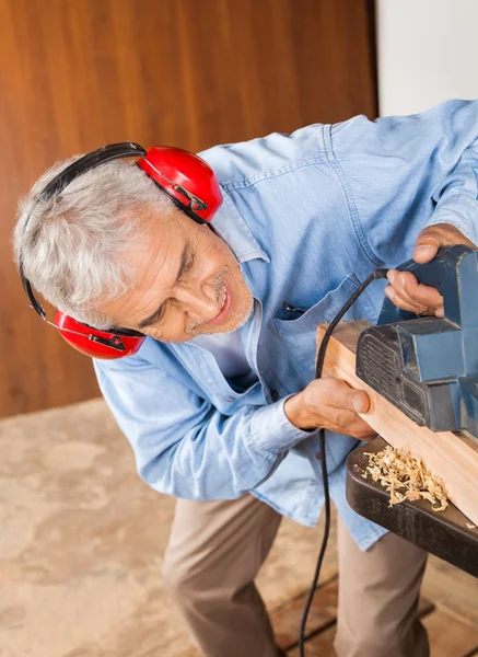 Carpenter Shaving Wood With Electric Planer — Stock Photo, Image