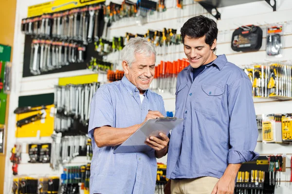 Customers Checking Checklist In Hardware Store — Stock Photo, Image