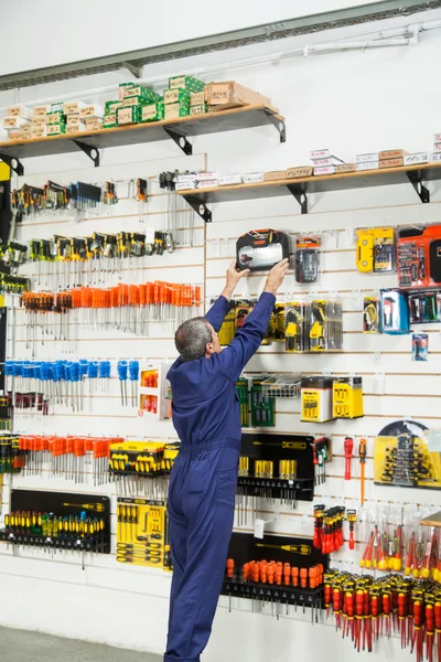 Worker Reaching For Bit Case In Shop — Stock Photo, Image