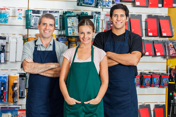 Salespeople Standing In Hardware Store