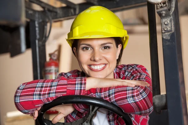 Happy Engineer Leaning On Forklifts Steering Wheel — Stock Photo, Image