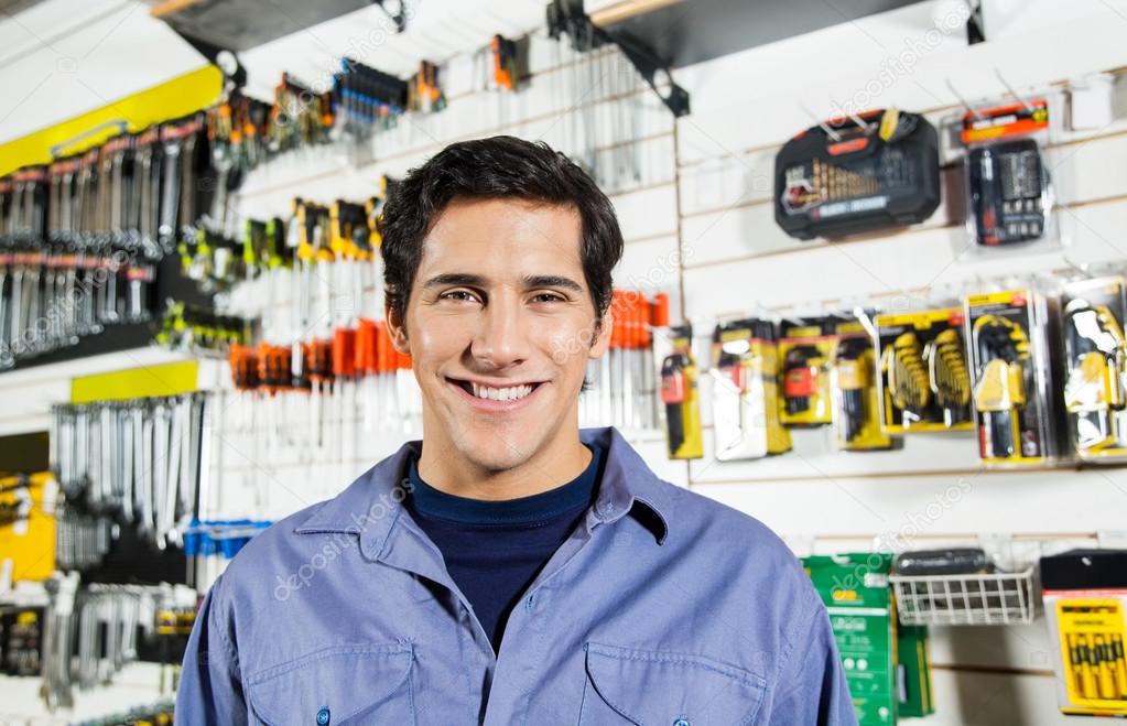 Confident Man Smiling In Hardware Shop