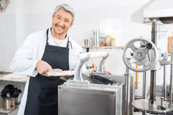 Happy Chef Processing Ravioli Pasta In Machine — Stock Photo, Image