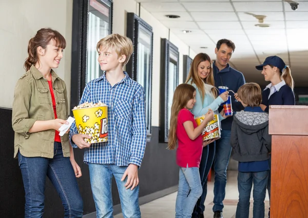 Siblings Talking At Cinema — Stock Photo, Image