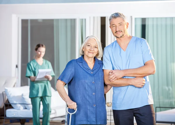 Confident Male Caretaker And Disabled Senior Woman — Stock Photo, Image