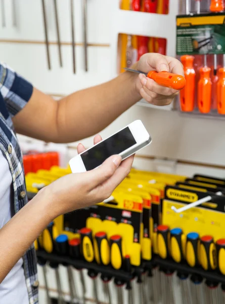 Cropped Image Of Customer Holding Cellphone And Screwdriver — Stock Photo, Image