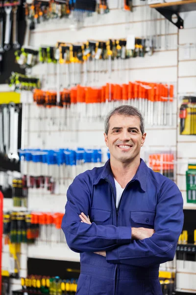 Worker Standing Arms Crossed In Hardware Shop — Stock Photo, Image