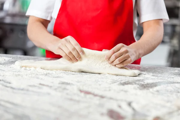 Chef Kneading Dough In Commercial Kitchen — Stock Photo, Image