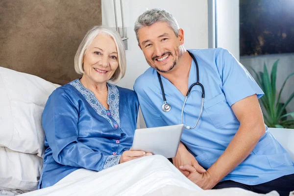 Happy Senior Woman And Caretaker With Tablet PC — Stock Photo, Image