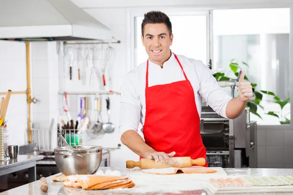 Confident Chef Gesturing Thumbsup While Rolling Ravioli Pasta Sh — Stock Photo, Image