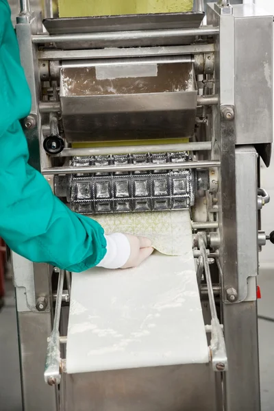 Chef Removing Ravioli Pasta From Machine — Stock Photo, Image