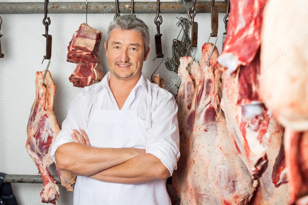 Butcher Standing Arms Crossed In Butchery