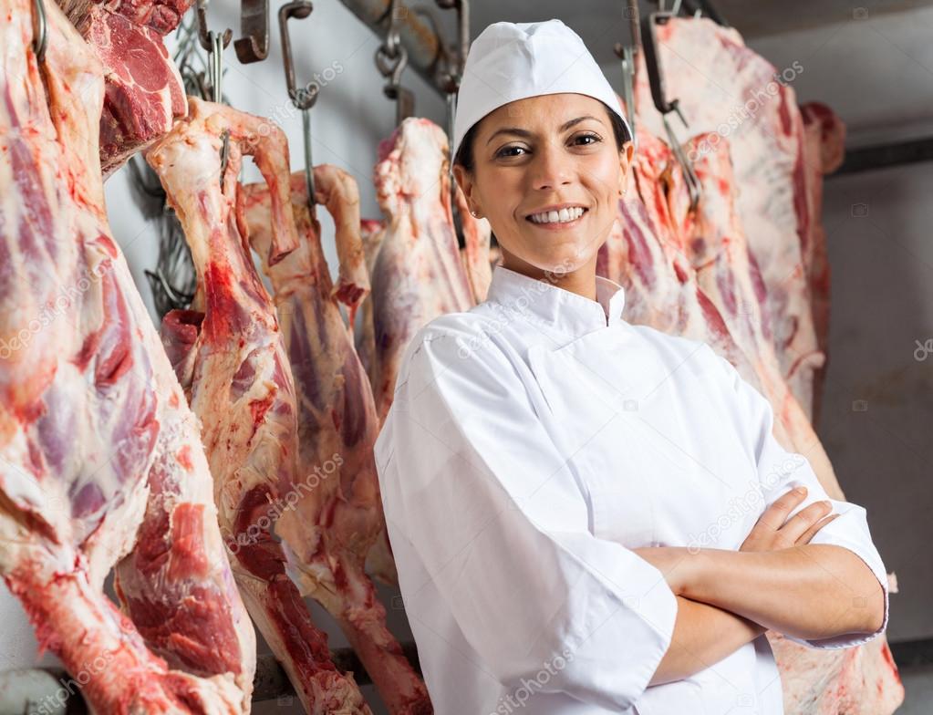 Happy Female Butcher In Slaughterhouse