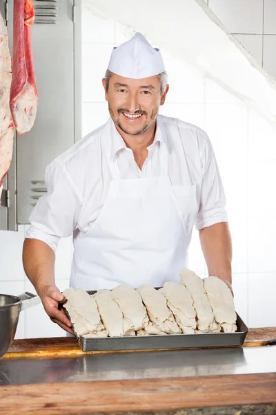 Tabuleiro segurando bandeja enchida com galinha de dragagem — Fotografia de Stock