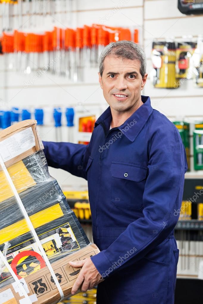 Worker Carrying Tool Package In Hardware Shop