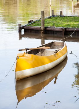 Canoe Moored In Lake clipart
