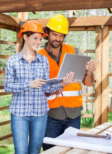 Architects Using Laptop Together At Construction Site — Stock Photo, Image