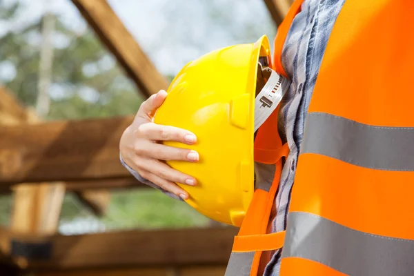 Construction Worker Holding Yellow Hardhat — Stock Photo, Image