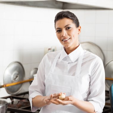 Smiling Chef Holding Pasta Dough Ball In Kitchen