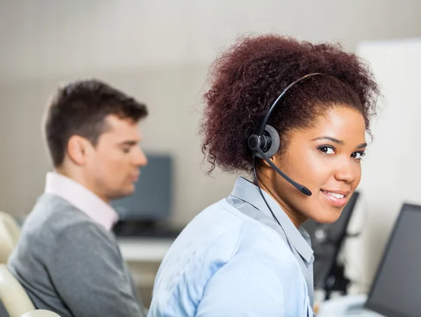 Customer Service Representative Wearing Headset At Office Desk — Stock Photo, Image