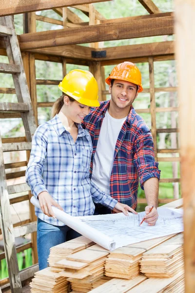 Happy Architect Examining Blueprint With Colleague — Stok fotoğraf