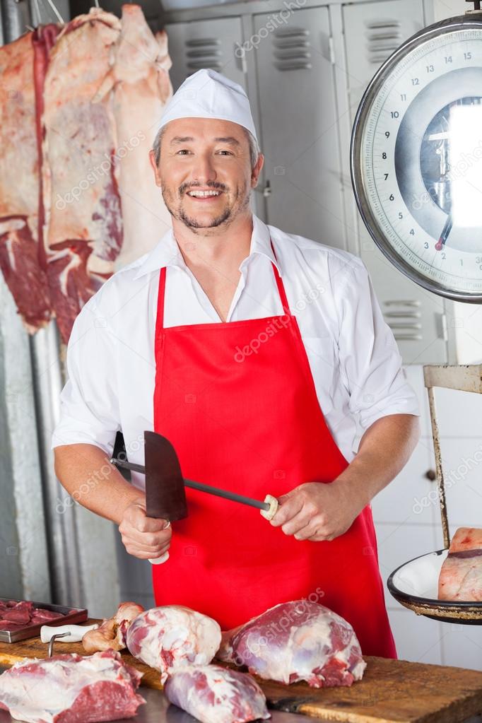 Butcher Sharpening Knife In Butchery — Stock Photo © SimpleFoto 76280861