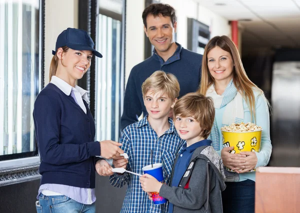 Happy Family Getting Tickets Checked By Worker At Cinema — Stock Photo, Image