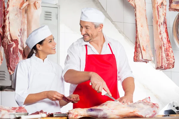 Butchers Looking At Each Other While Working — Stock Photo, Image