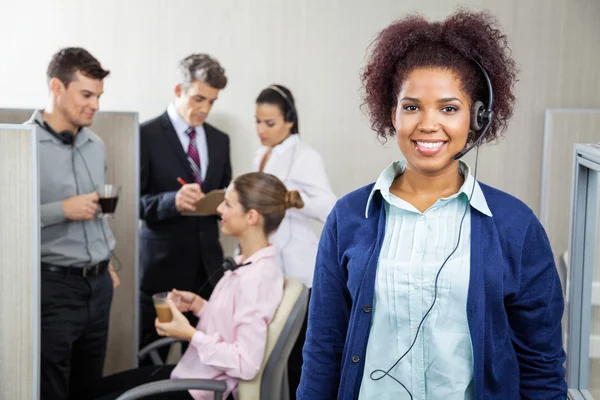 Happy Female Customer Service Representative Wearing Headphones — Stock Photo, Image