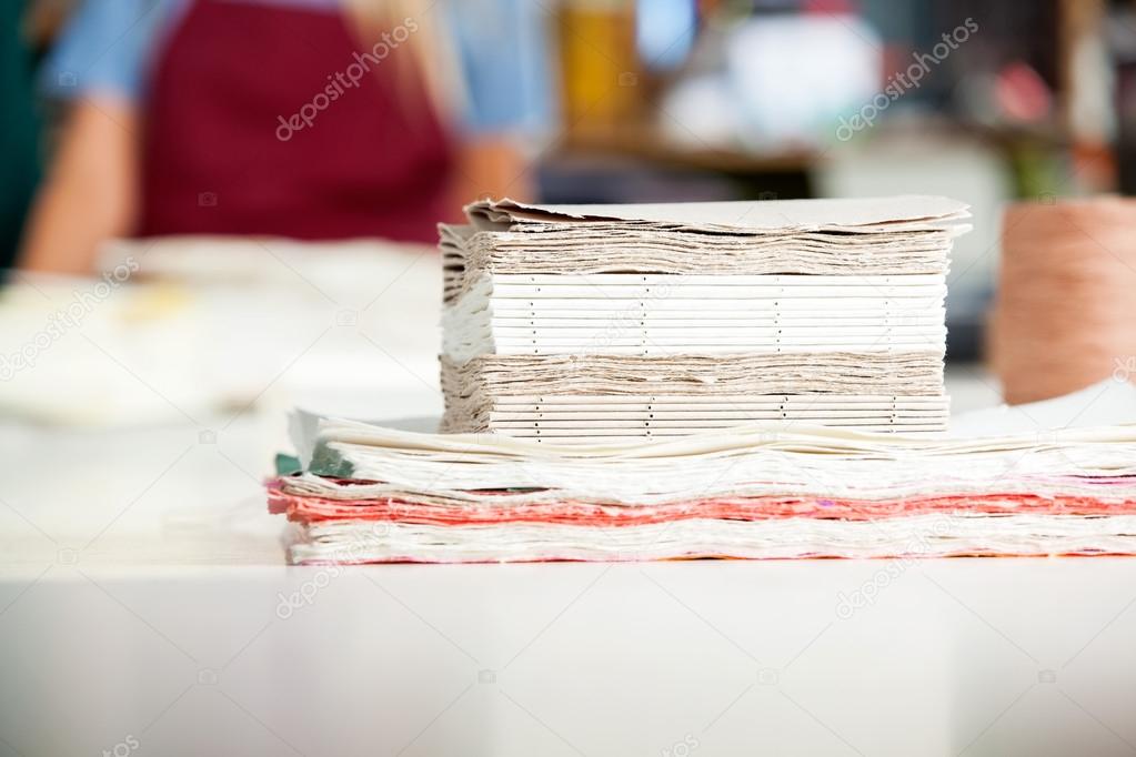Stacked Papers Ready For Making Notepads On Table