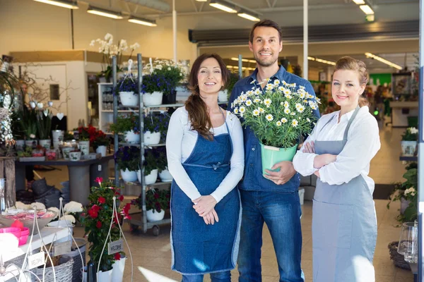 Man Holding Potted Plant White Standing By Salesgirls — Stock Photo, Image