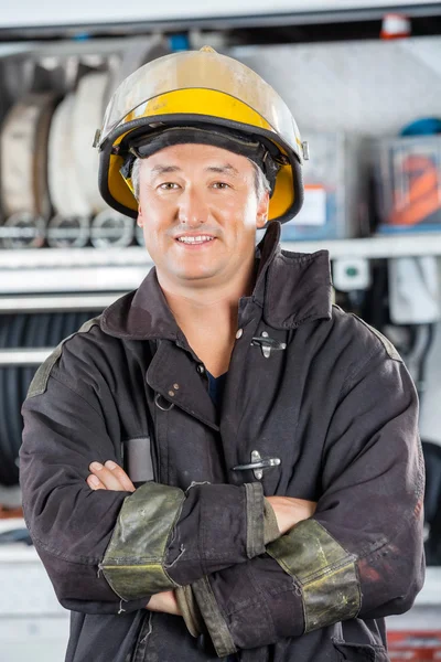 Happy Fireman Standing At Fire Station — Stock Photo, Image