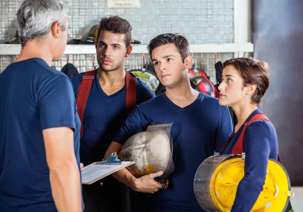 Fireman Discussing With Team — Stock Photo, Image