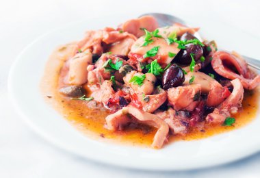 Octopus in tomato sauce (shallow dof) clipart