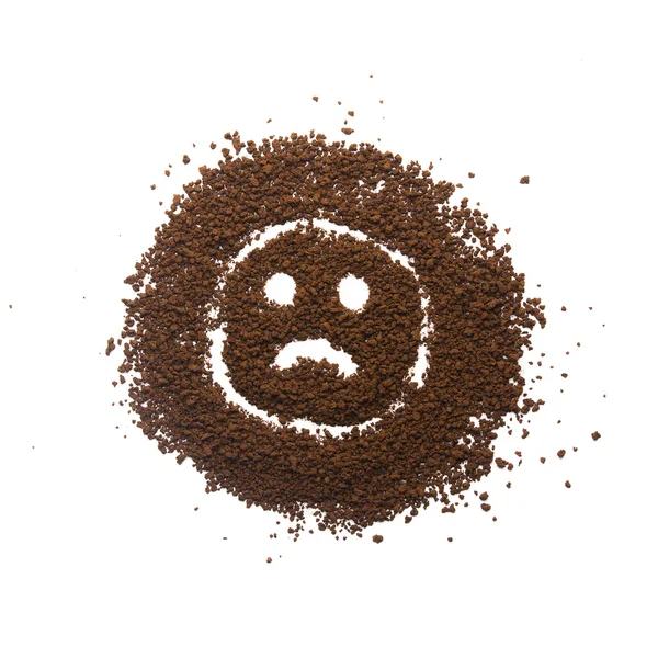 Körniger Kaffee mit traurigem Emoticon — Stockfoto