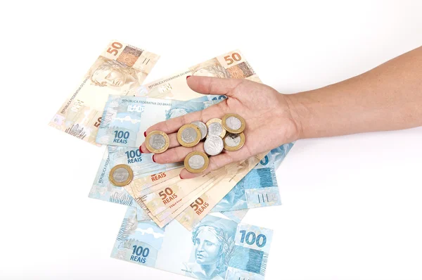 Vrouw hand en Braziliaanse geld — Stockfoto