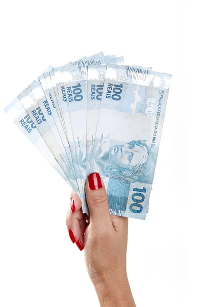 Vrouw hand en Braziliaanse geld — Stockfoto