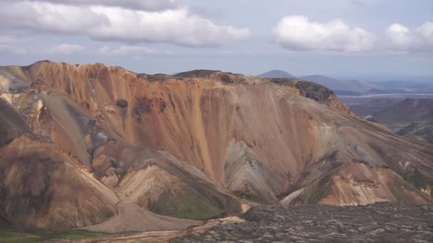 Landmannalaugar Valley. Iceland. Colorful mountains on the Laugavegur hiking trail. The combination of layers of multi-colored rocks, minerals, grass and moss — Stock Video