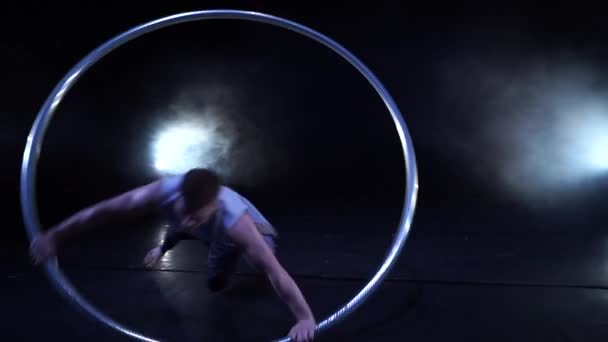 Circus artist dancing with cyr wheel. concept of concentration, willpower, and movement — Stock Video